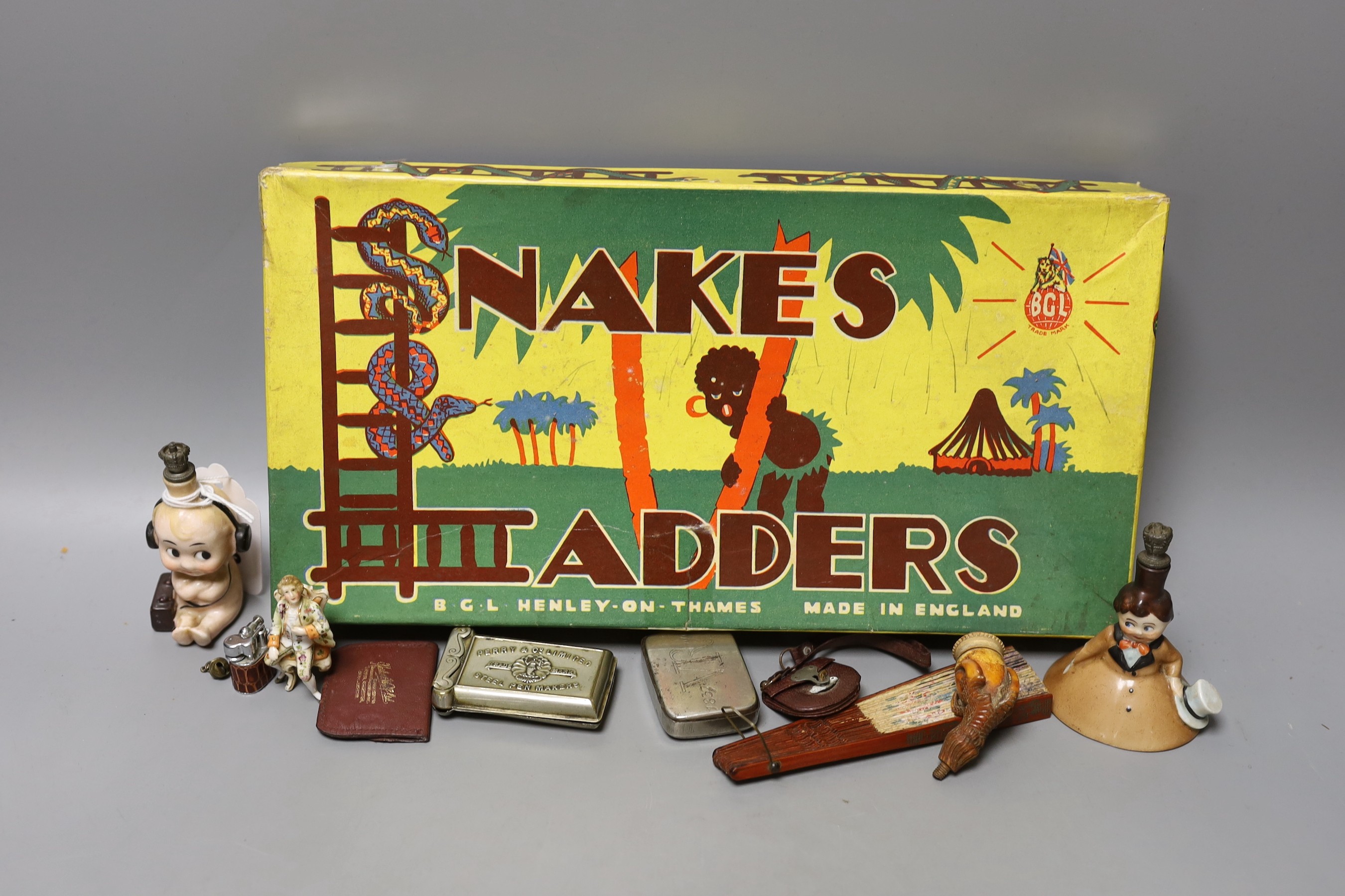 A group of collectables including a Boer War horn cup, a 1930's Betty Boop ceramic scent bottle, a commemorative Wedgwood Nelson jug, etc.